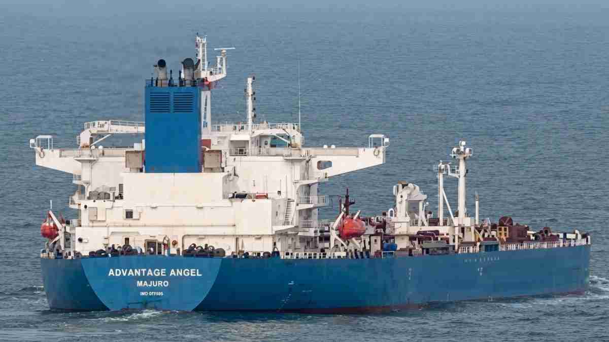 Blue-and-white cargo ship named Advantage Angel sailing in open water, Majuro listed on hull